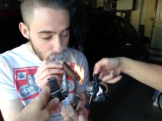 triple-flame-cigar-lighting Triple flame lighting a cigar