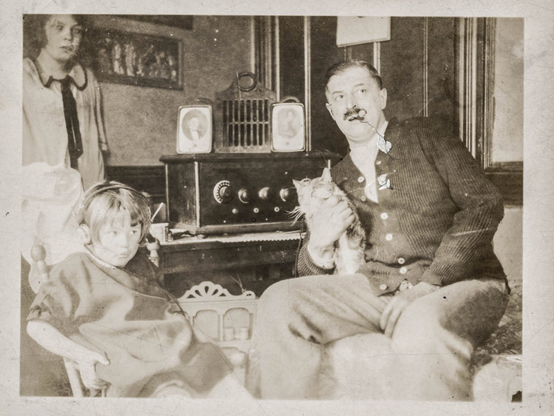Vintage man smoking cigar with cat
