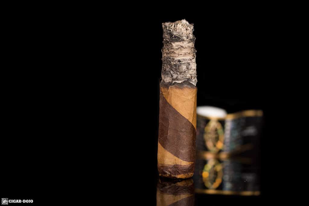 Quesada Reserva Privada Barber Pole Robusto cigar nubbed