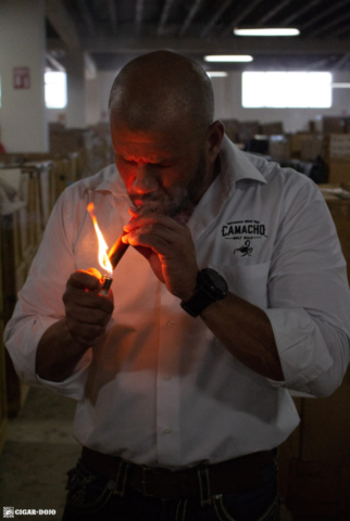 Manuel Batista lighting cigar