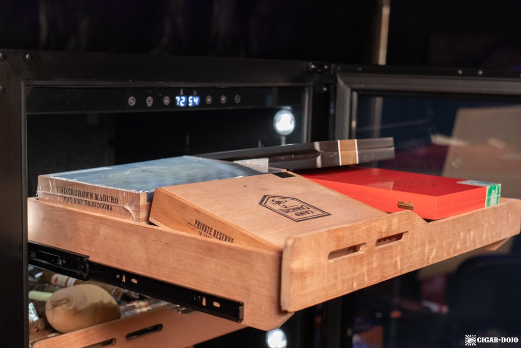 Newair NCH1K5BK00 1500 count humidor shelf filled with cigar boxes