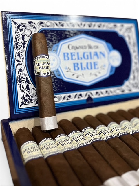 Crowned Heads Belgian Blue LE 2026 cigar resting on an open box